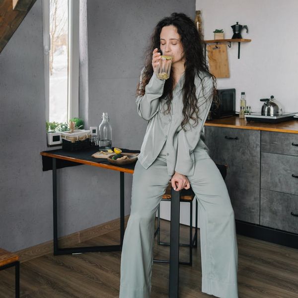 Person meditating in a calm environment showing peace of mind.